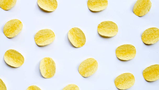 Potato chips on white background. Top view - Foto, afbeelding
