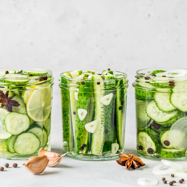 Variaty of Canned Cucumbers with Spices, Garlic, Onion and Lemon, square, copy space for your text - Foto, Imagen