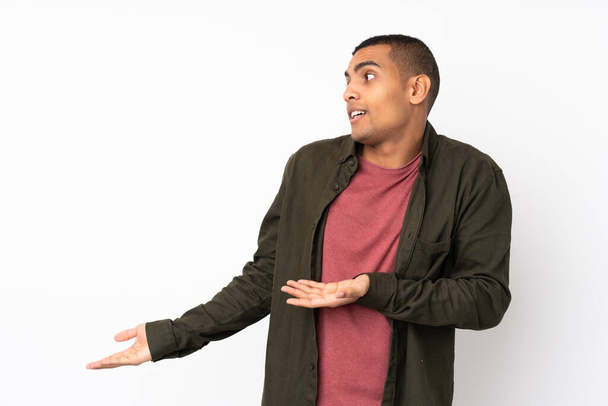 Young African American man over isolated white background with surprise facial expression - Photo, image