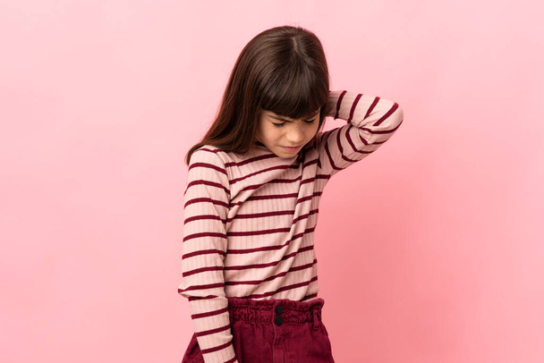 Little girl isolated on pink background with neckache - Фото, зображення