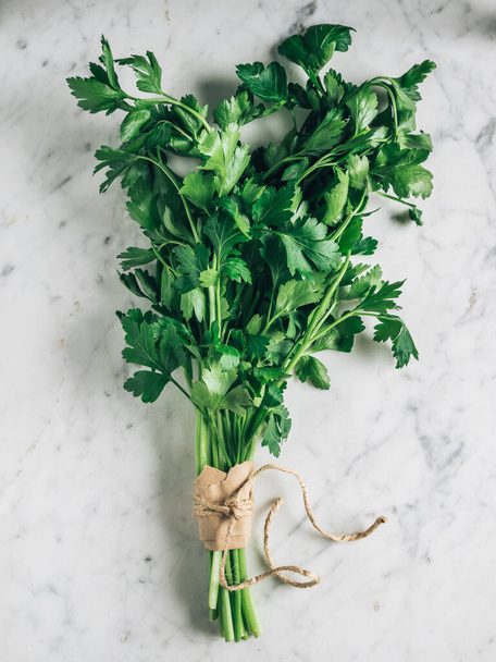 A bunch of fresh green parsley on white background - 写真・画像