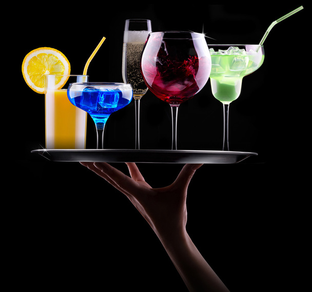 Different alcohol drinks set on a tray - Photo, image