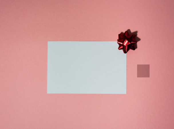 Christmas postcard or photo frame on a pink background - Фото, зображення