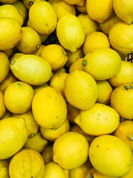 muchos limones amarillos maduros para cocinar como fondo - Foto, Imagen