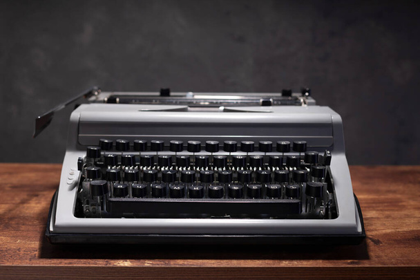 old retro typewriter at wooden table, creative writer concept - Valokuva, kuva