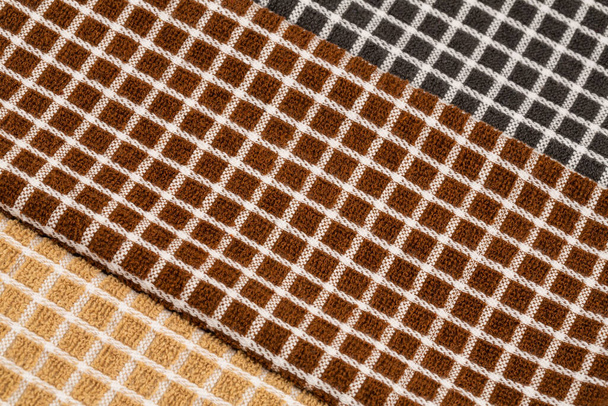 Textura de toallas marrón, negro y beige como fondo. - Foto, Imagen