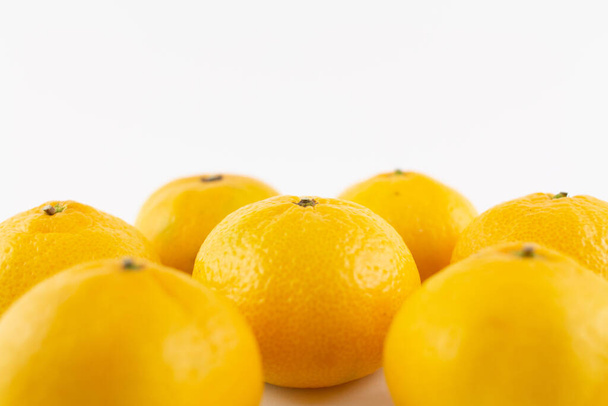 a beautiful ripe tangerines on a white background - Zdjęcie, obraz