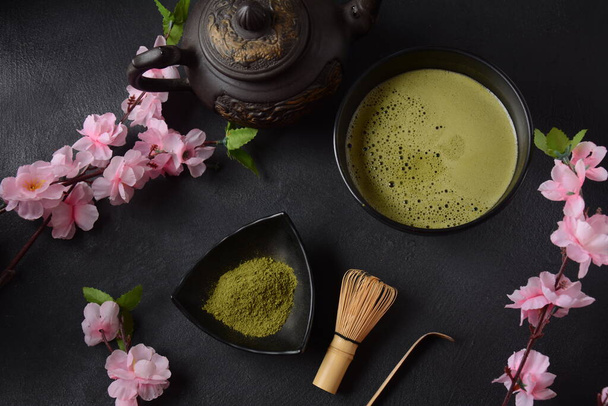 Green matcha tea drink and tea accessories on white background. Japanese tea ceremony concept. Detox tea. Antioxidant drink - Foto, imagen