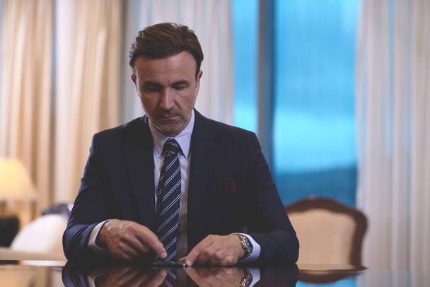 corporate business man using smart phone at luxury office - Valokuva, kuva