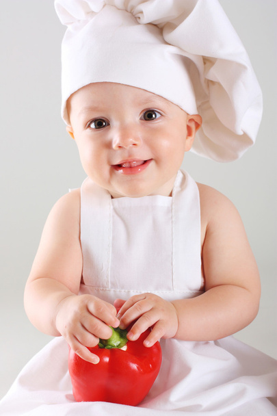 Petit bébé dans une casquette chef au poivre
 - Photo, image