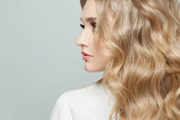 Woman face profile. Perfect model with healthy curly hair - 写真・画像