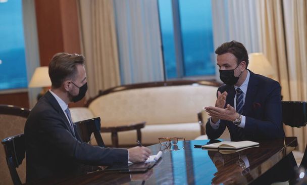 business people wearing crona virus protection face mask on meeting - Foto, Imagem