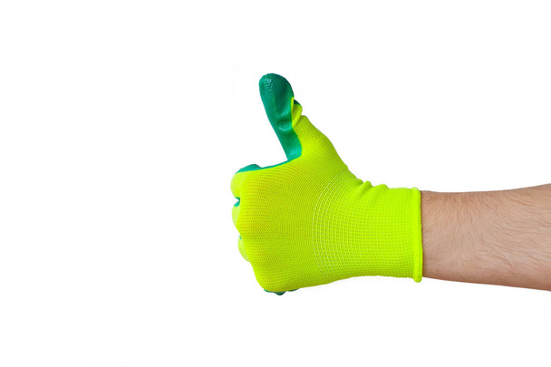 Zeigen Sie Daumen hoch. Männliche Hand in einem Handschuh für die Arbeit im Garten, Gemüsegarten isoliert auf weißem Hintergrund. Kopierraum. - Foto, Bild