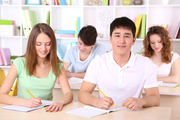 Group of young students sitting in class - Photo, image