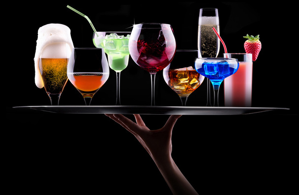Different alcohol drinks set on a tray - Foto, afbeelding