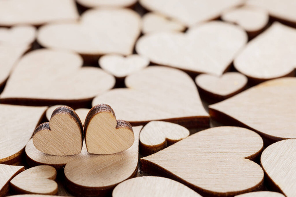 Many wooden colorless hearts background, two special ones true love concept - Fotografie, Obrázek