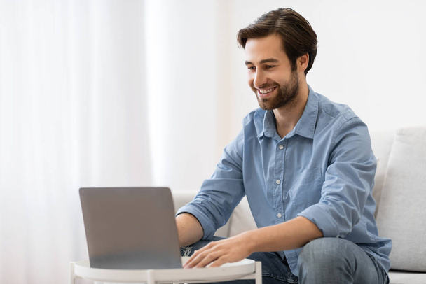Successful Young Businessman At Laptop Working Sitting On Couch Indoor - Photo, Image