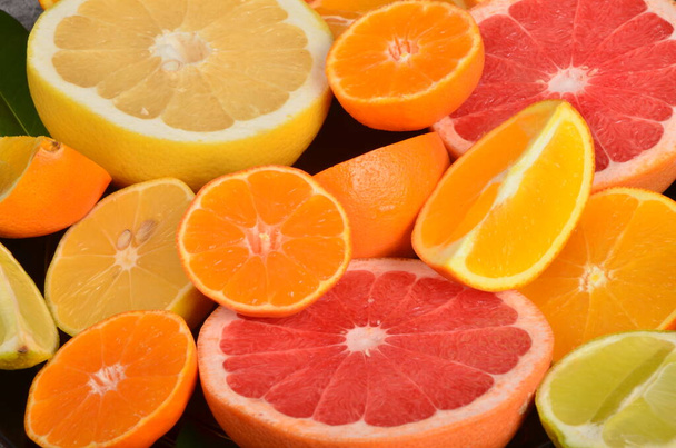 Close-up of sliced citrus fruits, Various citrus fruits, Citrus background - Фото, зображення