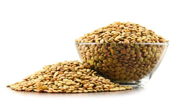 Composition with bowl of lentils isolated on white background - Photo, Image