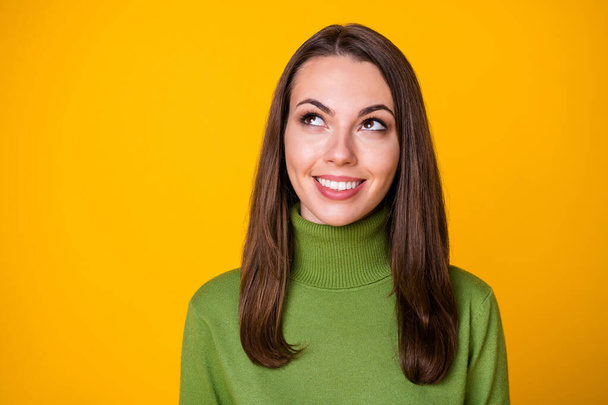 Close-up portrait of pretty curious dreamy cheerful girl overthinking copy space isolated over bright yellow color background - 写真・画像
