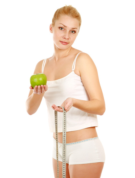 Woman with green apple and measure tape - Foto, Imagem