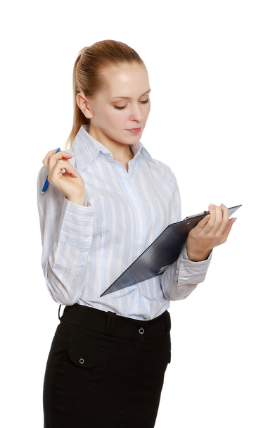 Businesswoman with a folder and a pen - Фото, изображение