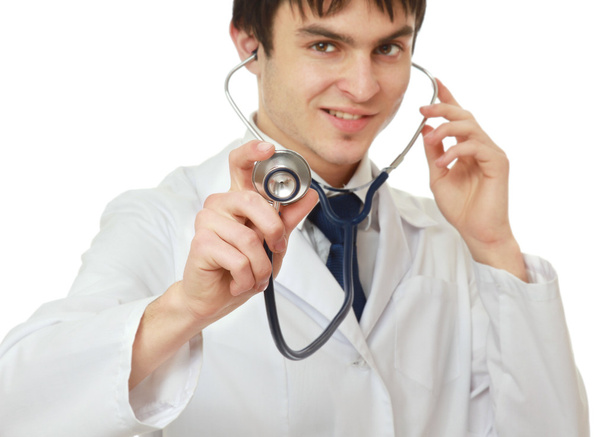 Doctor using his stethoscope. - Foto, afbeelding