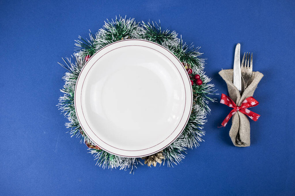 Top view of white plate with napkin. Christmas table setting. Flat lay, top view.  - Photo, Image