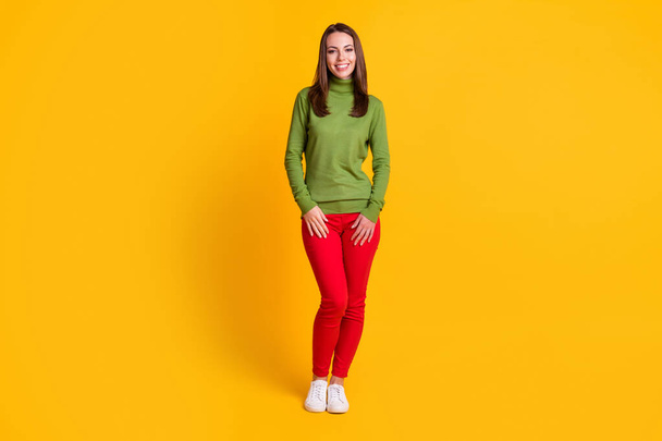 Full length body size view of thin pretty cheerful girl wearing casual cosy clothing isolated on bright yellow color background - Foto, afbeelding