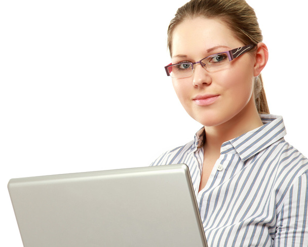 Woman wearing glasses in front of a laptop - Zdjęcie, obraz