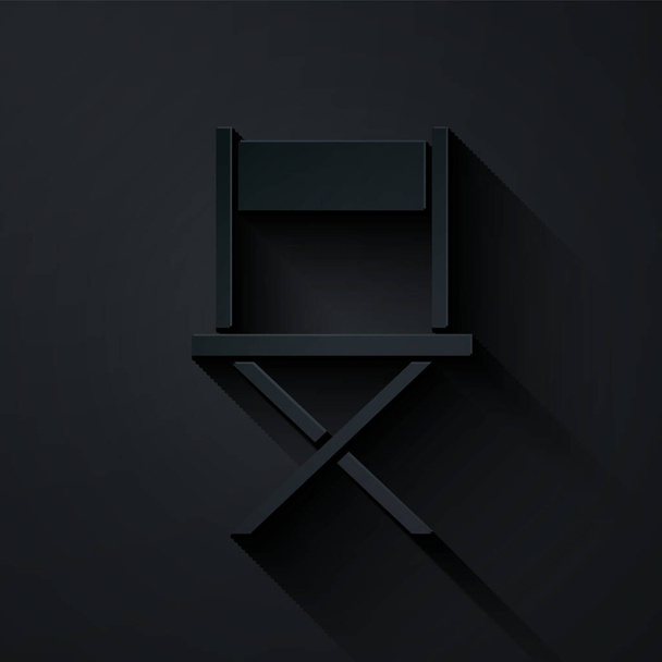 Řez papíru Režisér Film židle ikona izolované na černém pozadí. Filmový průmysl. Papírový styl. Vektor. - Vektor, obrázek