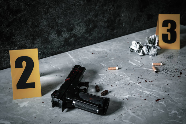 Crime scene markers and evidences on light grey marble table - Fotografie, Obrázek