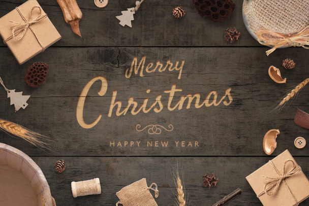 Merry Christmas and Happy New Year greeting card. Rustic top view composition. Carving handwork on wooden surface - Foto, Imagem