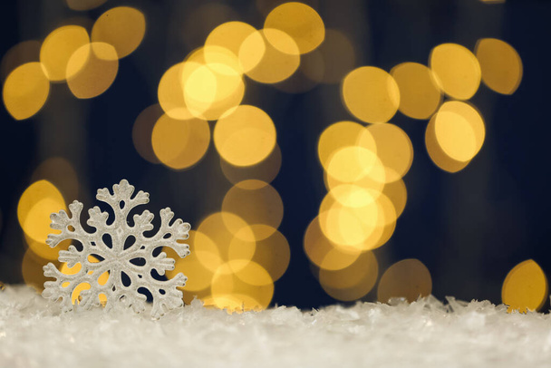 Beautiful decorative snowflake against blurred festive lights, space for text - Fotoğraf, Görsel