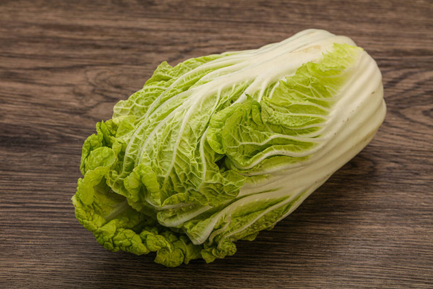 Vegan cuisine - Green fresh tasty Chinese cabbage - Фото, изображение