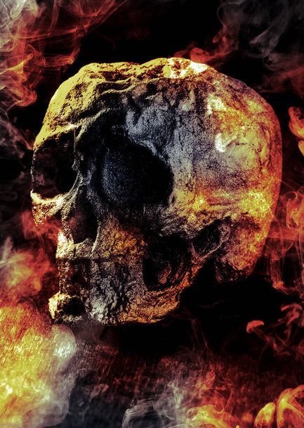 Scary demon Halloween skeleton skull burning in fire - Photo, Image