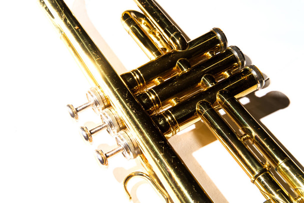 Old rusty Jazz instrument trumpet on plain background - Photo, Image