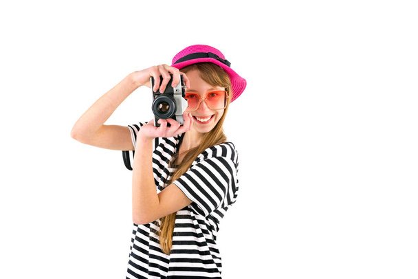 Happy hipster girl holding vintage camera in studio white isolated background - Foto, Imagen