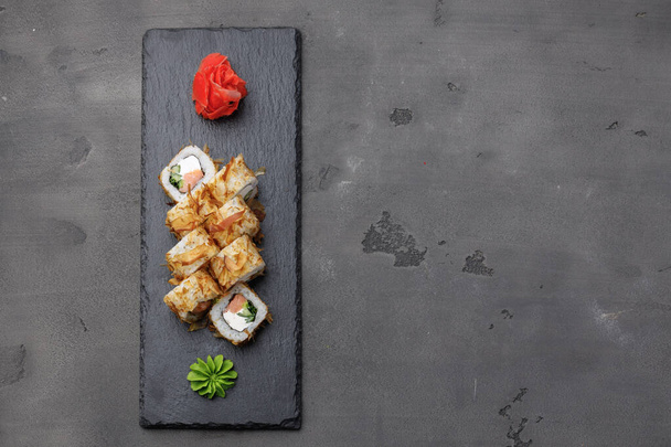 Top view of sushi roll with tuna shavings served on plate - Φωτογραφία, εικόνα