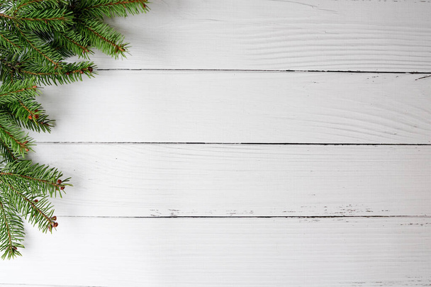 White Christmas card with pine tree on white wood - Φωτογραφία, εικόνα