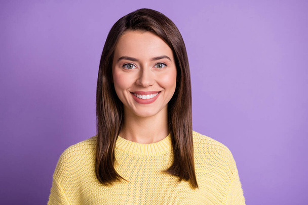 Photo portrait of young pretty brunette girl smiling wearing casual knitted yellow sweater smiling isolated on bright color purple background - Photo, Image