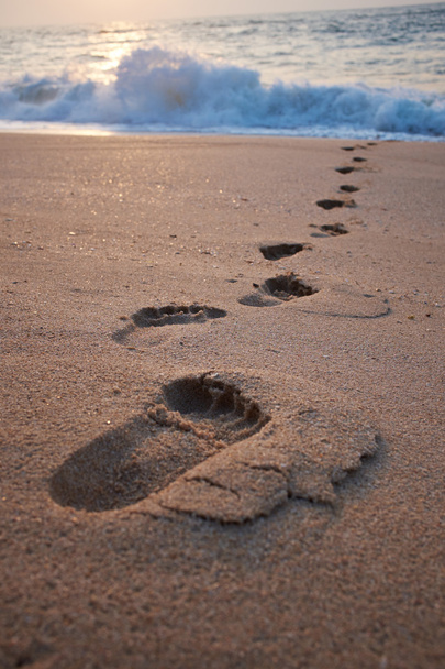 Footprints on the beach - Foto, afbeelding
