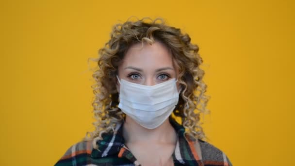 Closeup female portrait of pretty attractive trend modern hipster person wear facial quarantine safety cotton mask - Кадры, видео