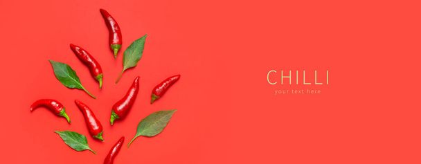 Hot red and green fresh chili peppers on red background flat lay top view copy space. Seasoning for dish, spicy spices for cooking, cayenne pepper, food. Creative layout, chili pattern. Banner. - Photo, image