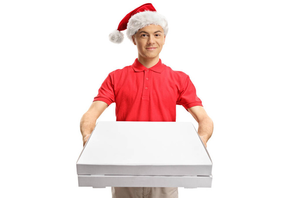 Pizza delivery boy with a santa claus hat holding pizza boxes isolated on white background - Foto, imagen