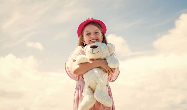 Excitement. teddy bear shop. toy shop for kids. happy childrens day. childhood happiness. little cheerful child with present. fluffy and cute gift. happy birthday. small girl play with bear toy - Photo, image