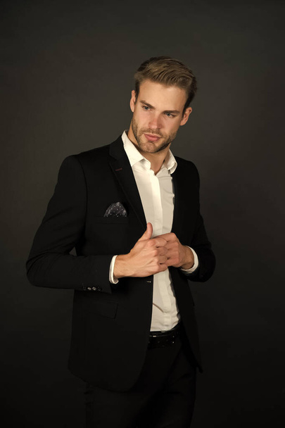 Formal wear for daily work. Bachelor in formal style. Handsome lawyer dark background. Dressing up for business meeting. Formal event. Dress code. Office attire. Fashion and style. Classy and formal - 写真・画像
