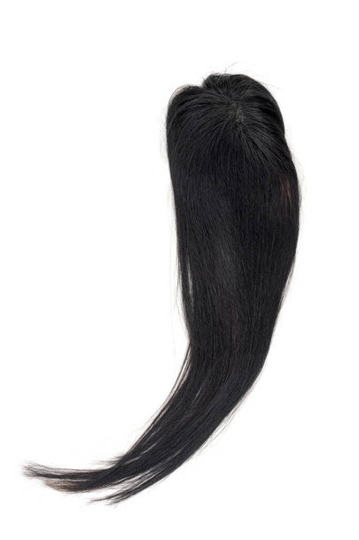Uma peruca preta jato ou cabeleireiro em um fundo branco. - Foto, Imagem