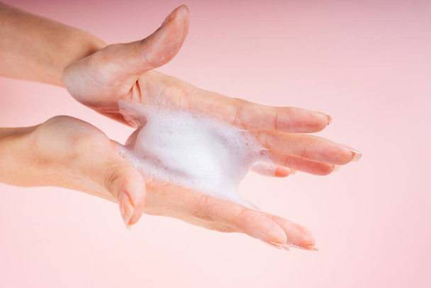 Woman hands with lotion skin cream or facial foarm. - Photo, image