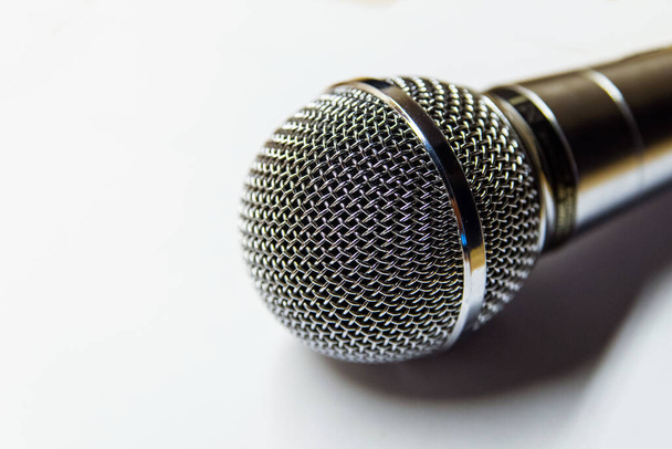 Silver audio microphone on white background surface. - Photo, Image